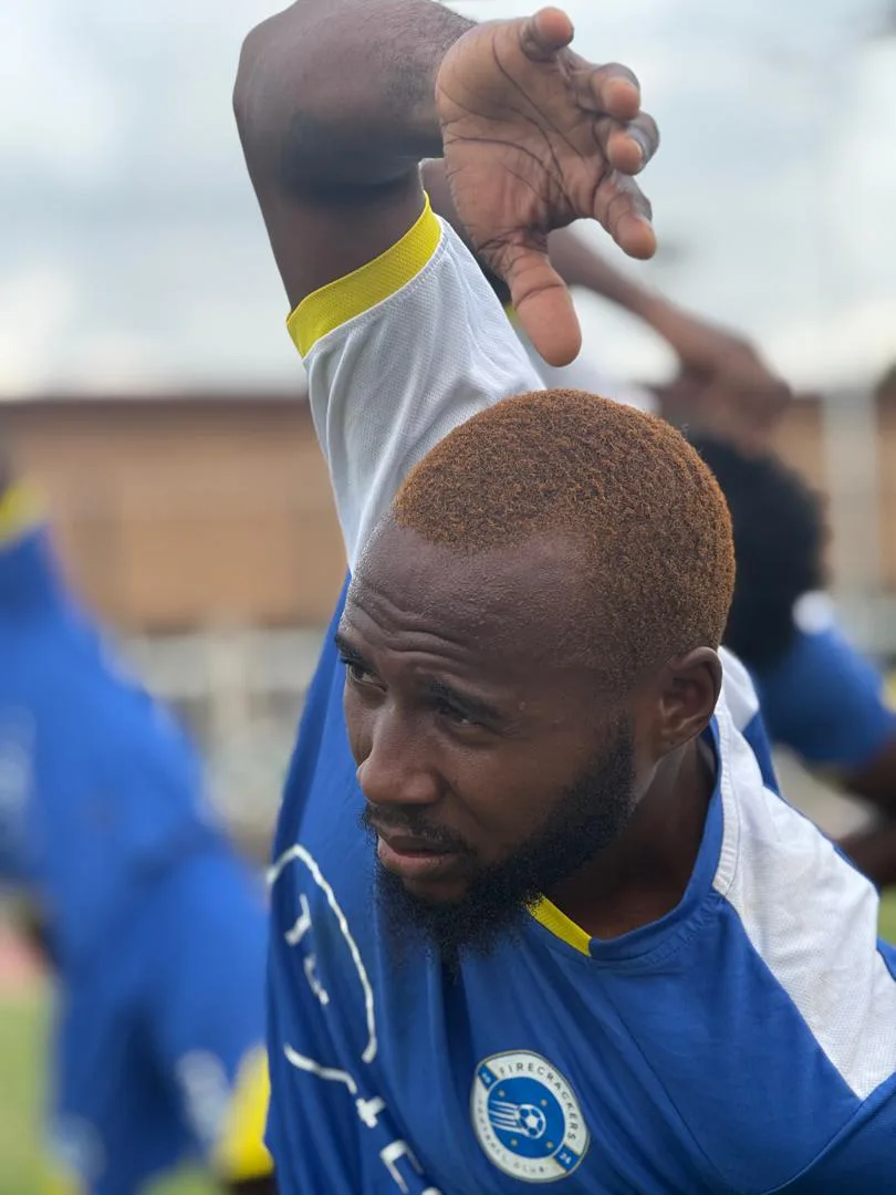 Olusegun Adewole warming up in the Firecrackers FC kit